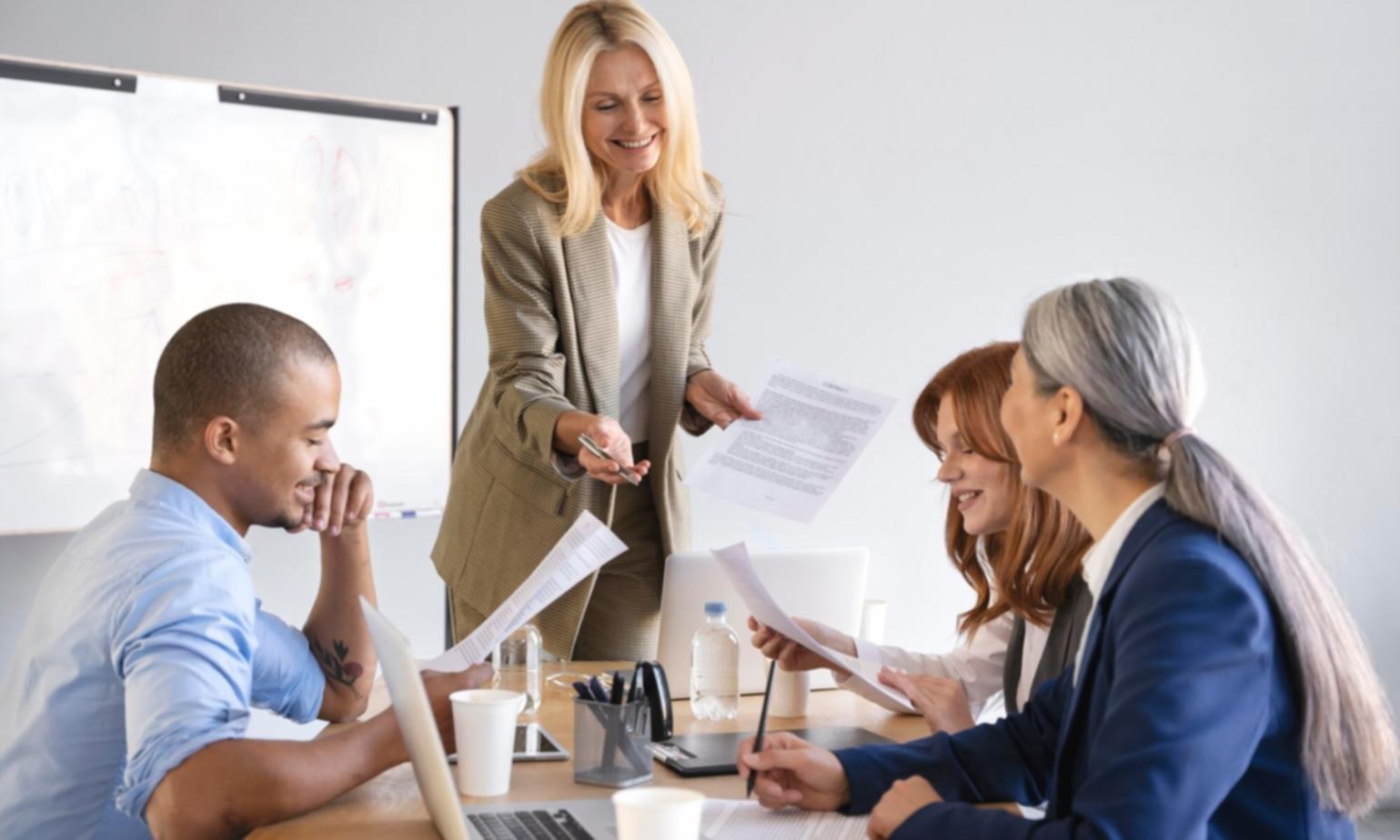 Financial analysts working on valuation models in modern Australian office environment