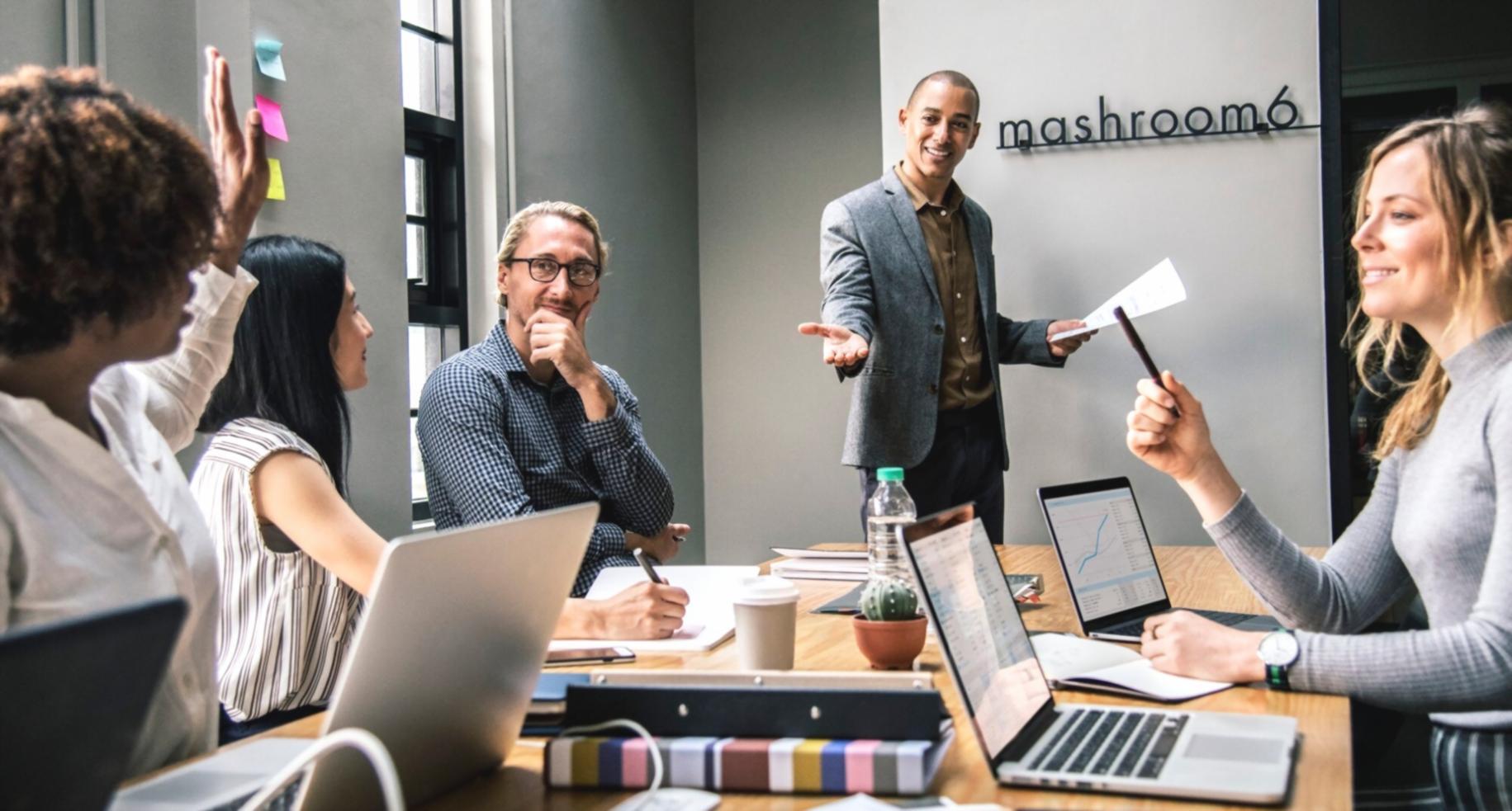 Financial analysts working on valuation models and market analysis in a modern office environment